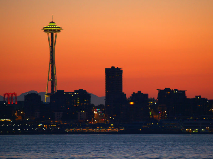 Seattle skyline against a fiery sunset